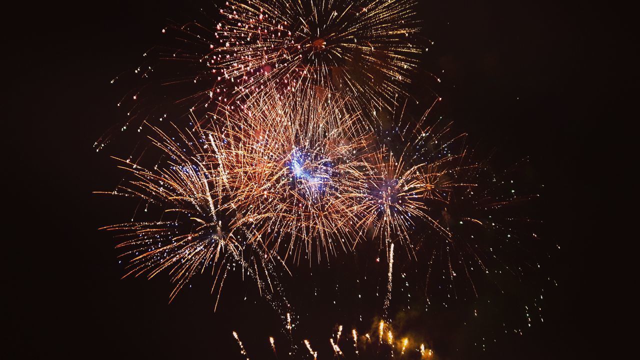 LOW ANGLE VIEW OF FIREWORK DISPLAY