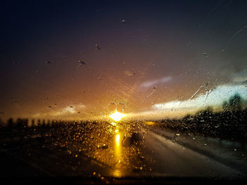 Raindrops on glass window of rainy season