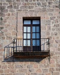 Low angle view of window on old building in colonial city of mexico
