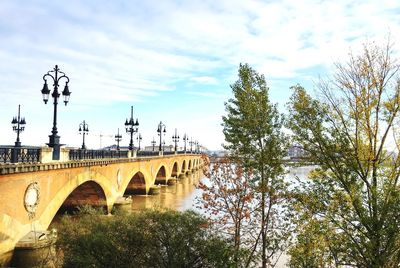 Pont de pierre over garonne river against sky