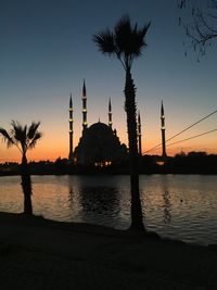 Silhouette of mosque at sunset