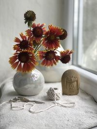 Close-up of flower vase on table at home