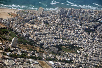 High angle view of cityscape by sea