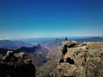 Panoramic view of landscape against blue sky