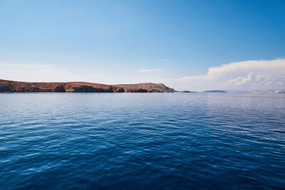 Scenic view of sea against blue sky