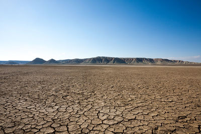 Scenic view of desert against clear sky