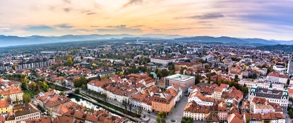 High angle shot of townscape against sky at sunset