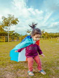 Cute girl smiling on field