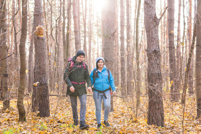 Full length of a man standing in forest