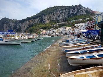 Boats moored at harbor