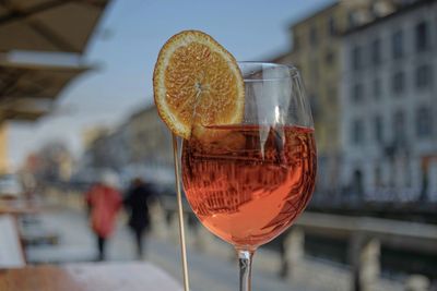 Close-up of alcoholic drink in city