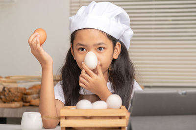 Portrait of cute girl having food