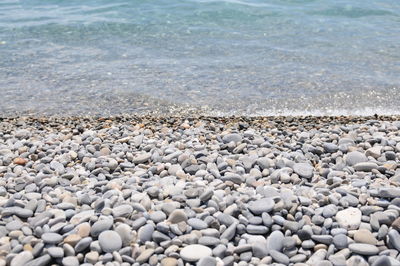 High angle view of pebbles on beach