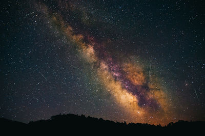 Low angle view of stars in sky at night