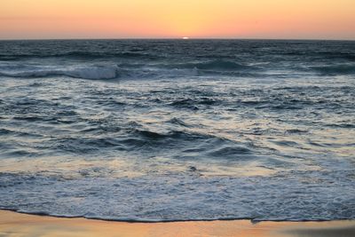 Scenic view of sea at sunset