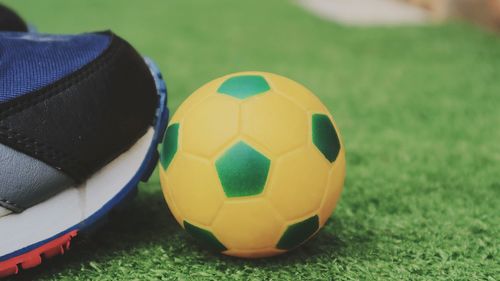 Close-up of ball on soccer field