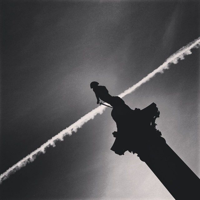 low angle view, sky, statue, sculpture, human representation, animal representation, art and craft, art, horse, creativity, cloud - sky, outdoors, silhouette, animal themes, day, one animal, no people, cloud, dusk