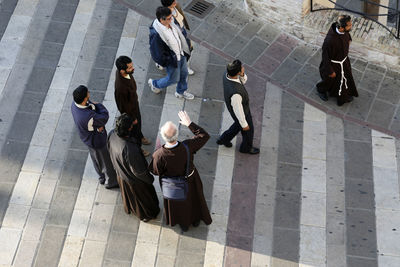 High angle view of people standing on floor