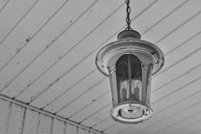 Low angle view of old lamp hanging from ceiling