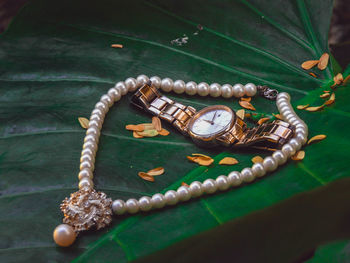 High angle view of clock on table