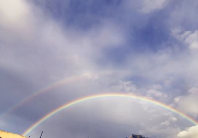 Low angle view of rainbow against sky