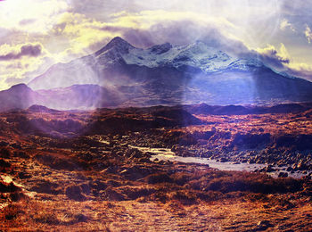 Aerial view of mountain range against sky