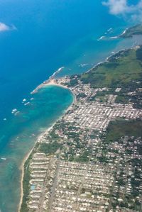 High angle view of sea and buildings in city