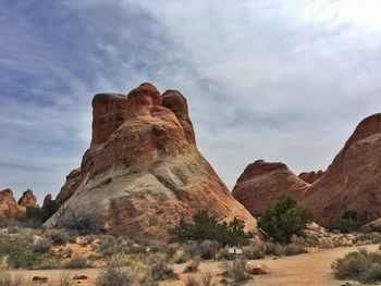 Low angle view of rock formation against sky