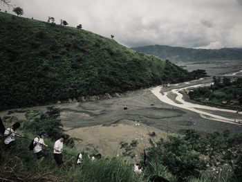 Scenic view of landscape against cloudy sky