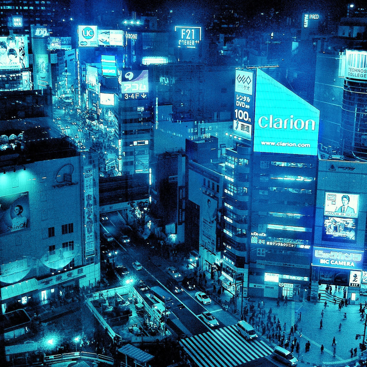building exterior, city, illuminated, architecture, night, built structure, transportation, text, communication, western script, street, city life, high angle view, city street, land vehicle, building, mode of transport, road, no people, information sign