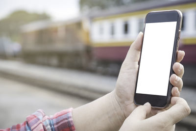 Close-up of person using mobile phone