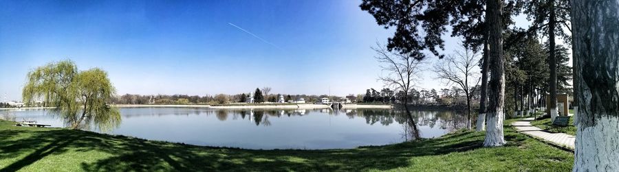 Panoramic view of lake against blue sky