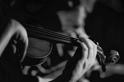 Close-up of person playing violin