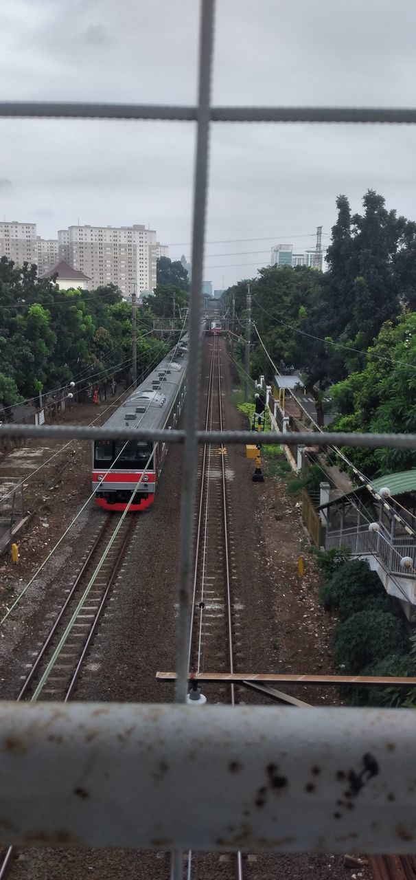 transport, plant, architecture, tree, nature, built structure, transportation, day, wall, no people, water, outdoors, track, railing, mode of transportation, high angle view, fence, building exterior