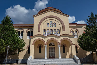 Facade of building against sky