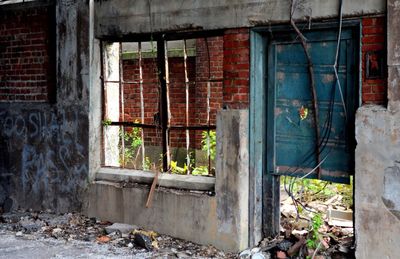 Damaged window of abandoned building