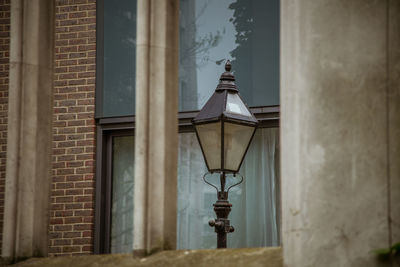 Street light against building