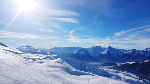 Scenic view of snowcapped mountains against sky