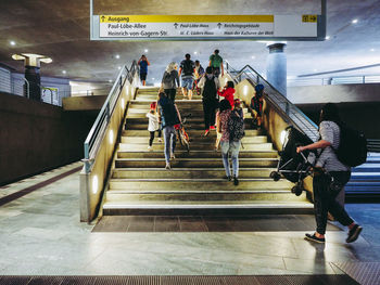 People on escalator at subway station