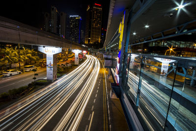 High angle view of light trails on road at night