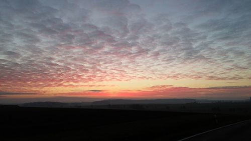 Scenic view of landscape against sky during sunset