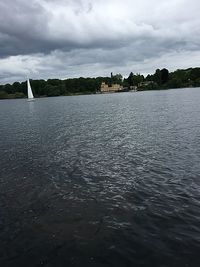 Scenic view of sea against cloudy sky