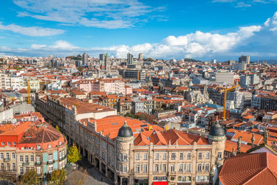 Aerial view of cityscape against sky