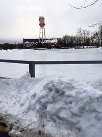 Snow covered landscape against sky