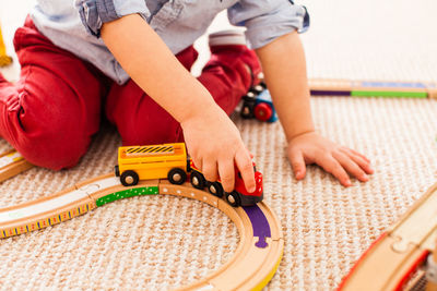 Rear view of boy playing with toy