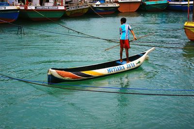 Boy on boat in water