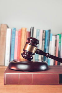 Close-up of gavel on table