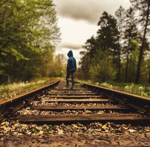 People walking on railroad track