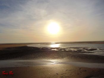 Scenic view of sea against sky at sunset