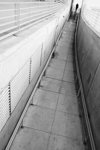 Tilt shot of person walking in narrow alley